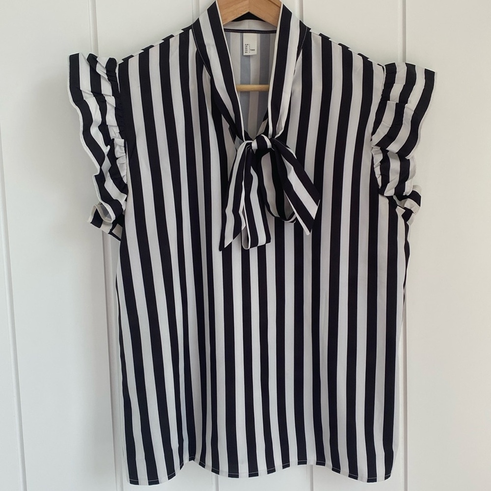 Black and white striped sleeveless blouse with tie at the neck